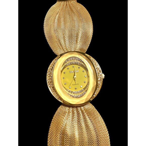Elegant and sophisticated featuring an elliptical dial and mesh bracelet. - Picture 1 of 4